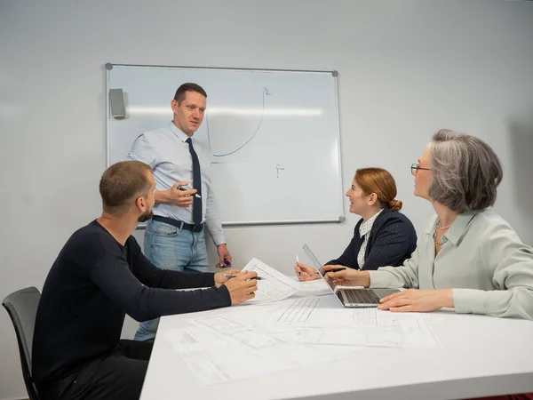 Caucasian Man Leading Presentation Colleagues White Board — Stockfoto