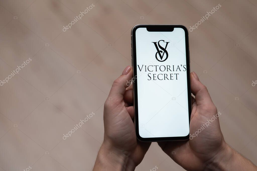 December 3, 2022, Almaty, Kazakhstan: a woman holds a smartphone with the Victorias secret logo