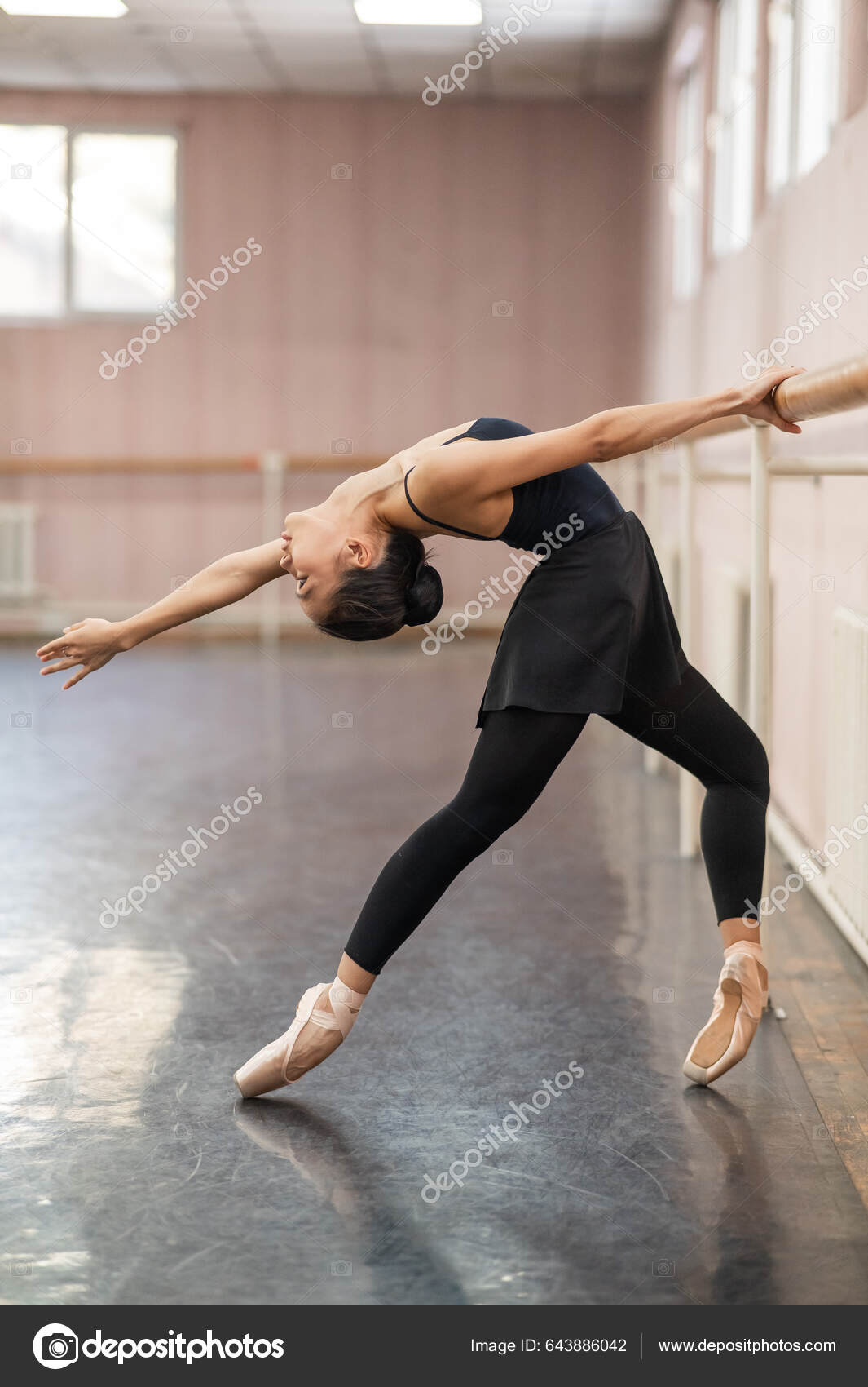 Asian Woman Doing Back Flexibility Exercises Ballet Barre Stock Photo by  ©inside-studio 643886042