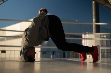 Caucasian male boxer warming up before a fight in the ring outdoors