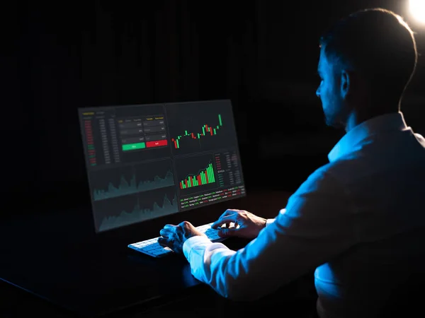 Caucasian Man Sits Dark Front Virtual Screen Stock Exchange Charts — Stock Fotó