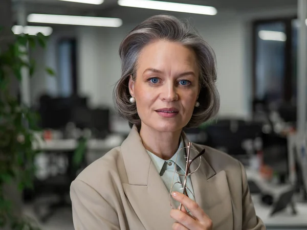 stock image Portrait of an attractive mature caucasian woman in the office