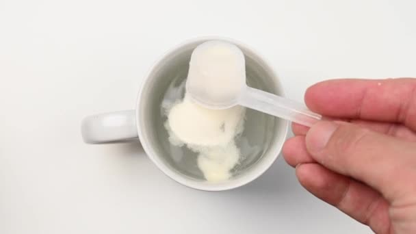 Man Pours Out Powder Measuring Spoon Dissolves Glass Water Sports — Stock Video