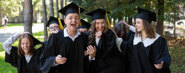 Group Graduates Robes Congratulate Each Other Graduation Outdoors — Stock Photo, Image