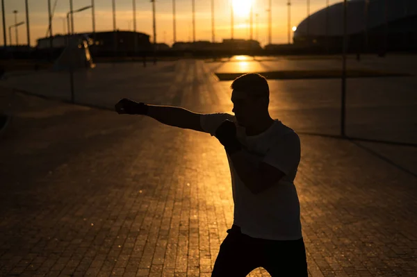 Man Trains Boxing Stadium Sunset Athlete Silhouette — Stockfoto