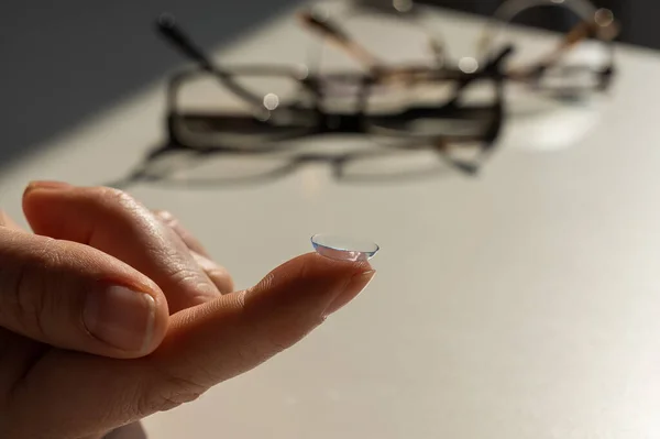 Close Contact Lens Female Index Finger Background Glasses White Table — Foto de Stock
