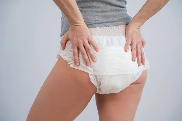 Woman Adult Diapers Holds Her Hands Her Stomach Urinary Incontinence Stock  Photo by ©inside-studio 613008508