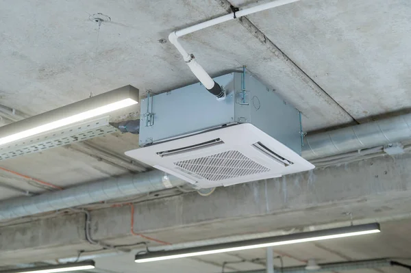Industrial air conditioner in the office on a concrete ceiling