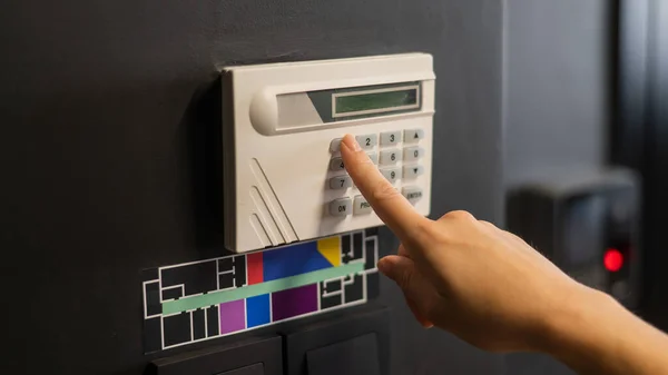 stock image Floor plan and switching lighting. The woman pressed the button