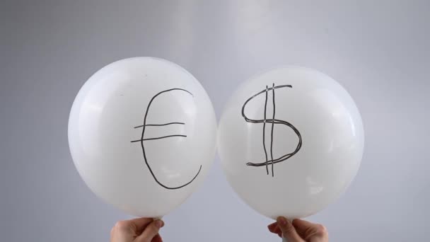 Woman Holding Two White Deflating Balloons Dollar Euro Symbols Fall — Stock Video