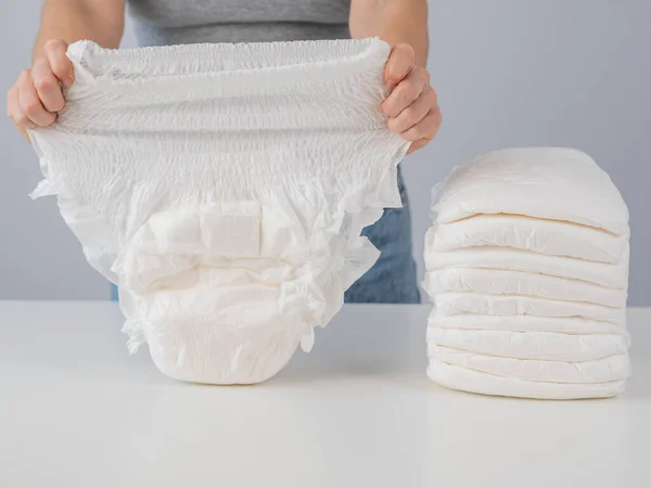 Woman Chooses Adult Diaper Pile Urinary Incontinence Problem — Stockfoto