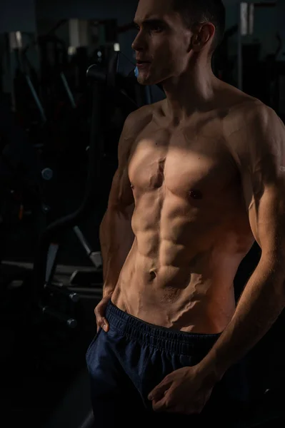 stock image Shirtless man with sculpted body in the gym