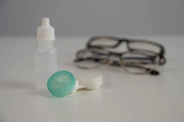 Two Pairs Glasses Lenses Contact Drops Eyes White Table — Foto Stock