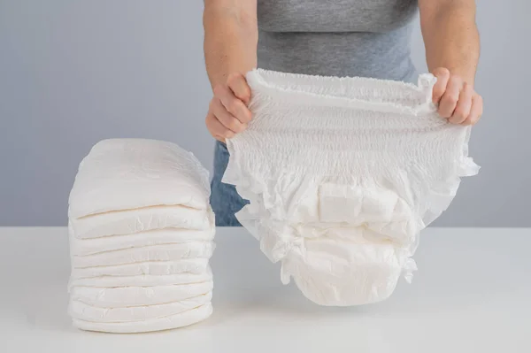 Woman Chooses Adult Diaper Pile Urinary Incontinence Problem — 스톡 사진