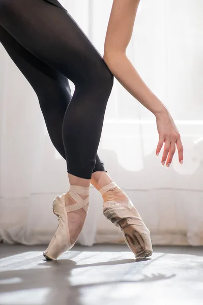 stock image Close-up of the legs and arms of a ballerina