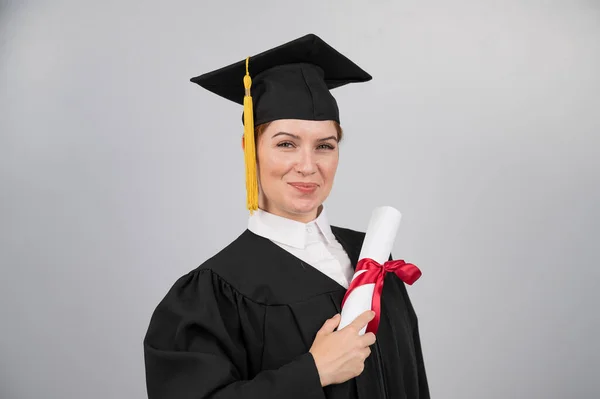 Smiling Woman Graduation Gown Holding Diploma White Background — Stock Photo, Image