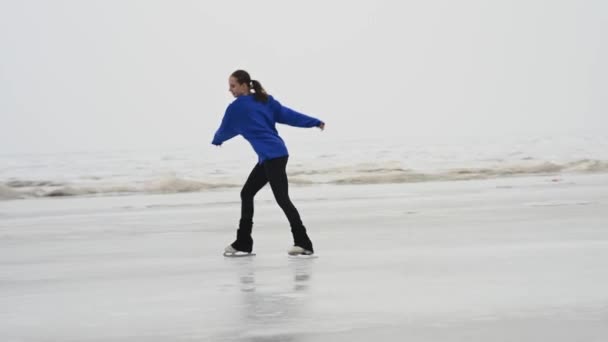 Caucasian Woman Blue Sweater Skating Frozen Lake Figure Skater Performs — стоковое видео