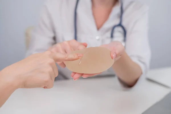 Caucasian Woman Plastic Surgeon Touching Choosing Breast Implants — Stock fotografie