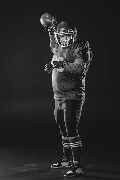 Portrait Man Uniform American Football Throws Ball Black Background Monochrome — Stock Photo, Image