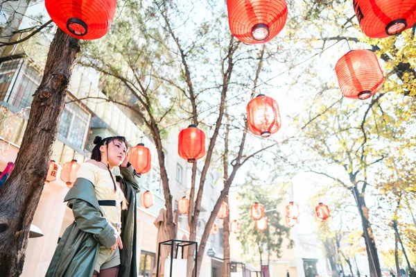 stock image Portrait of an Asian woman against the background of Chinese lanterns