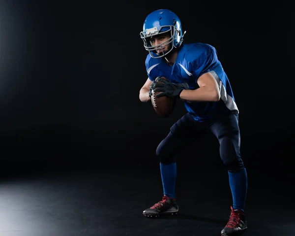 Full Length Portrait Man Blue American Football Uniform Black Background — стоковое фото
