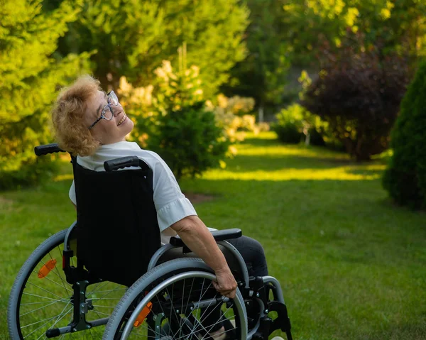 Happy Elderly Woman Sitting Wheelchair Walk Outdoors — Stockfoto