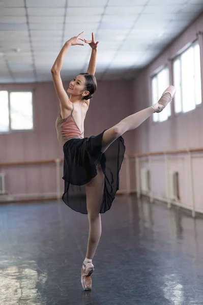 Asian Woman Doing Back Flexibility Exercises Ballet Barre Stock Photo by  ©inside-studio 643886042