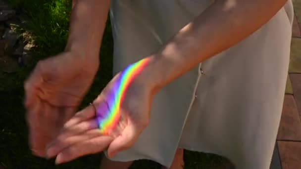 Faceless Woman Catching Rainbow Ray Her Hands Outdoors — Stock Video