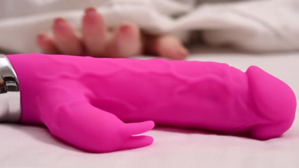 Woman Takes Pink Dildo While Lying White Blanket – stockvideo