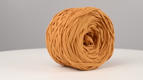 Ball Mustard Colored Cotton Yarn Spinning White Background — Stock Video