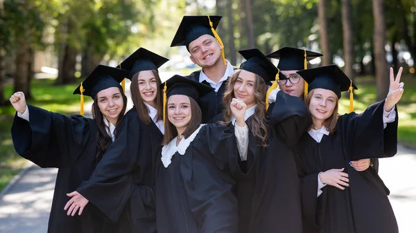 Group Happy Young People Graduation Gowns Outdoors Students Walking Park — Stock Photo, Image