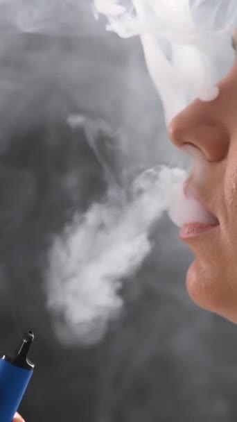 Close Lips Woman Smoking Vape Vertical Video — Stock Video