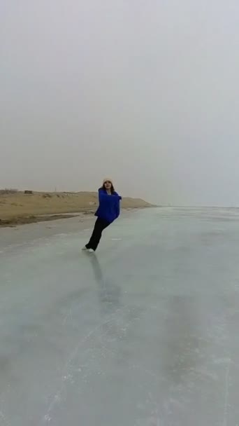 Caucasian Woman Blue Sweater Skating Frozen Lake Figure Skater Performs — стоковое видео