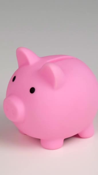 Faceless Caucasian Woman Folds Small Heart Pink Piggy Bank White — Stock Video