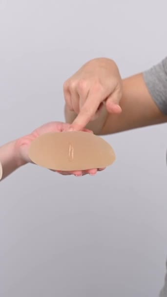 Caucasian Woman Plastic Surgeon Choosing Breast Implants Vertical Video — Stock Video
