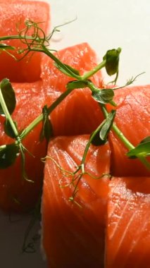 Set of philadelphia rolls spin on a white background. Vertical video