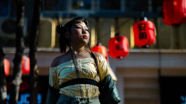 Portrait of an Asian woman against the background of Chinese lanterns