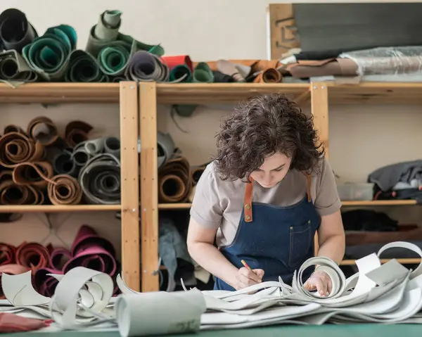 stock image Woman tanner at work in the workshop