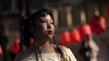 Portrait of an Asian woman against the background of Chinese lanterns