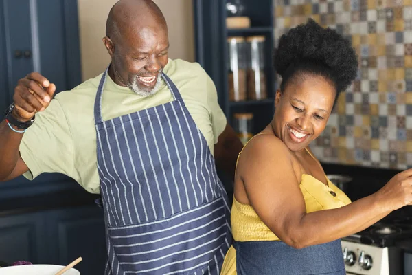 Happy Senior African American Couple Wearing Aprons Dancing Kitchen Senior — Stock Photo, Image