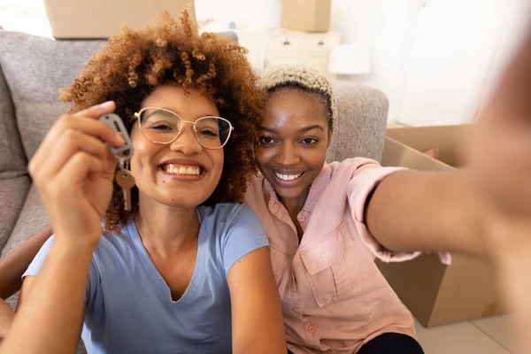 Portrait Cheerful Multiracial Lesbian Couple Showing New House Key While — Stock Photo, Image