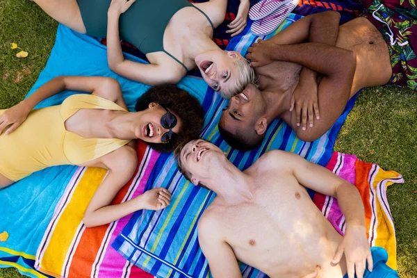 Happy Diverse Group Friends Lying Towels Laughing Garden Lifestyle Friendship — Stock Photo, Image