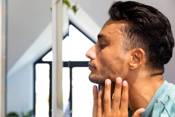 Biracial Man Touching His Face Looking Himself Bathroom Mirror Lifestyle — Stock Photo, Image