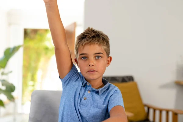 Portrait Caucasian Serious Boy Raising Hand While Studying Home Copy — Stock Photo, Image