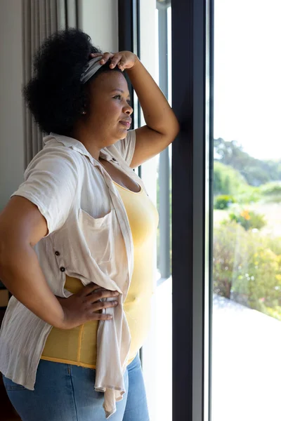 Thoughtful Size African American Woman Leaning Looking Out Window Domestic — Stock Photo, Image