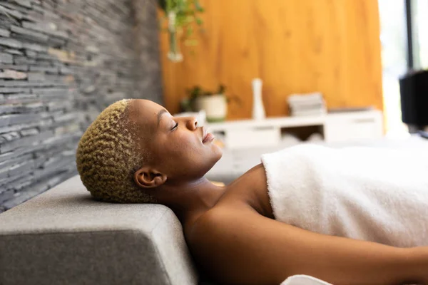 Happy African American Woman Wearing Towel Lying Eyes Closed Spa — Stock Photo, Image