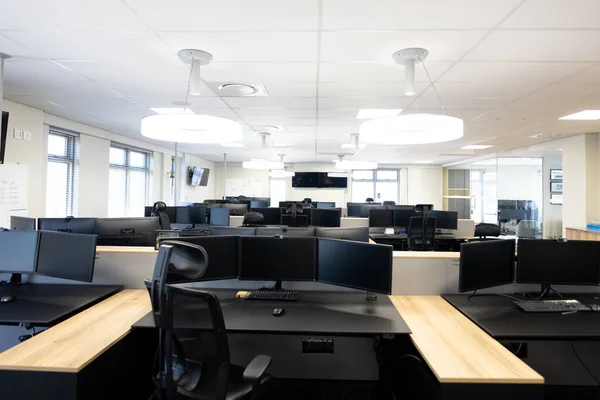 Empty Creative Modern Office Room Desks Computers Global Business Finances — Stock Photo, Image
