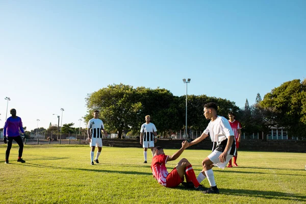 Multiracial Player Holding Hand Assisting Injured Opponent Get Match Playground — Stock Photo, Image