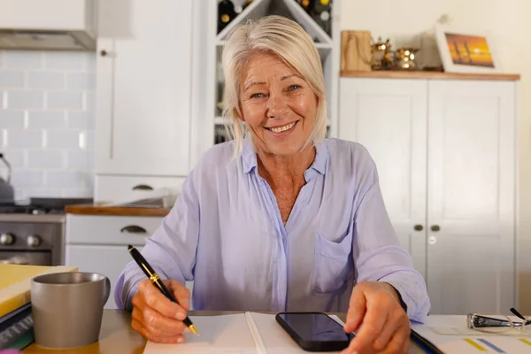Happy Senior Caucasian Woman Sitting Table Kitchen Having Video Call — Stock Photo, Image