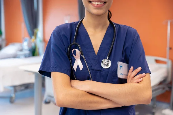 Midsection Smiling Biracial Female Doctor Using Cancer Ribbon Hospital Ward — Foto de Stock
